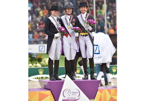 Photo : Les trois médaillés : or (Charlotte Dujardin), argent (Kristina Sprehe) et bronze Beatriz Ferrer-Salat) à Aachen, pour le Grand Prix Freestyle (photo Rolex/Kit Houghton)